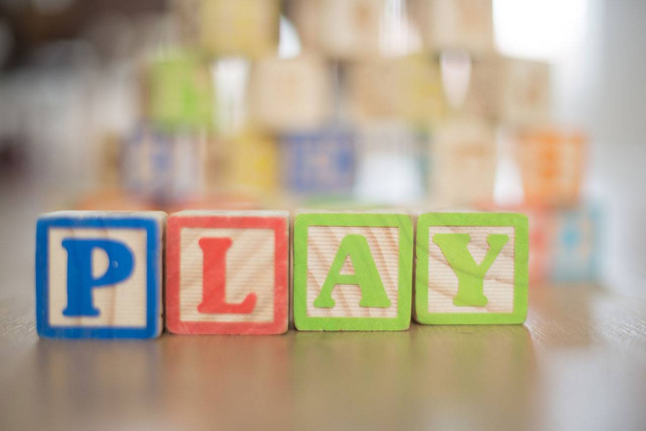 The colorful blocks illustrate word play at a childcare center in Highpoint.